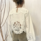 Blusa con pizzo e maxi maniche