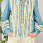 Camicia con ricami e nappine
