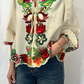 Camicia con ricami floreali
