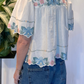 Blusa con ricami