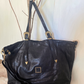 Shopper in pelle con fibbie texane