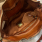 Borsa in pelle con frangine borchiate
