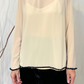 Top con bordini paillettes