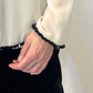 Top con bordini paillettes