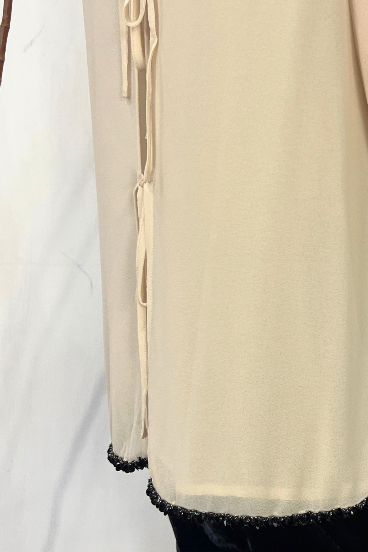 Top con bordini paillettes