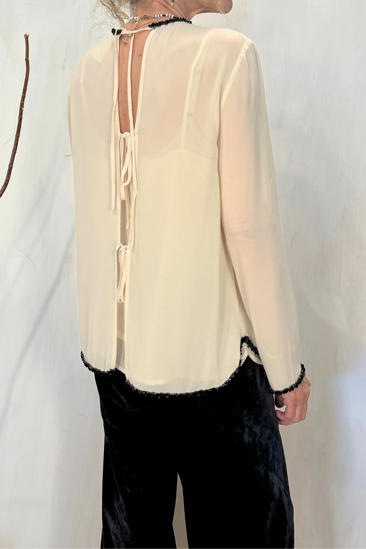 Top con bordini paillettes