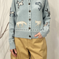 Cardigan iin lana con ricami e toppe
