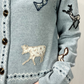 Cardigan iin lana con ricami e toppe
