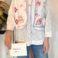Gilet con ricami e laccetto