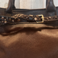 Shopper in pelle con borchiette