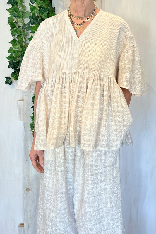 Blusa con plissetatture