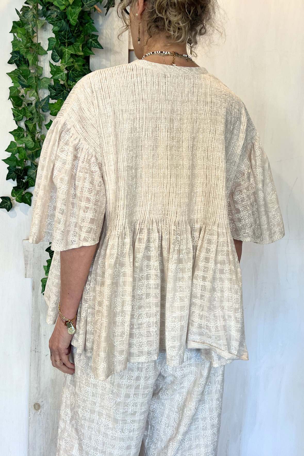 Blusa con plissetatture
