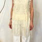 Top smanicato con pizzo e frange