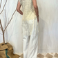 Top smanicato con pizzo e frange
