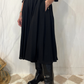 Abito polo in lana con cintura